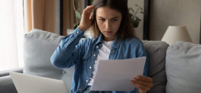 woman checking her visa rejection letter